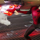 Spider-Man lifting a car.